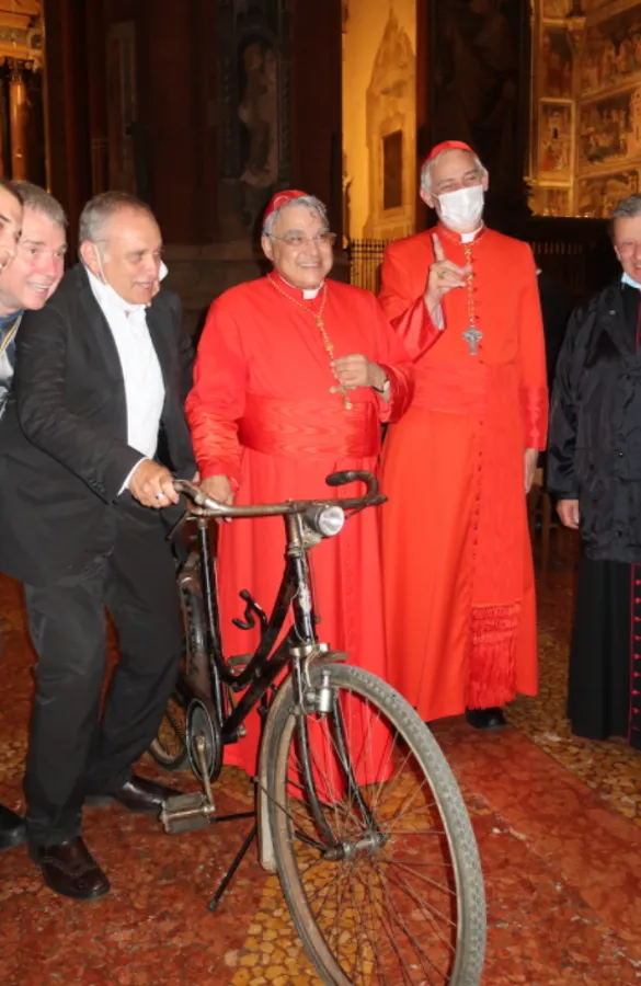 Cardinal Marcello Semeraro with Blessed Giovanni Fornasini’s bicycle in Bologna, Italy, Sept. 26, 2021. Antonio Minnicelli and Elisa Bragaglia.