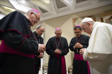 Pope Francis prays with French bishops before his general audience, Oct. 6, 2021, in the wake of a devastating abuse report