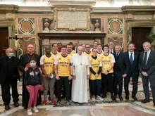 Pope Francis with members of the ‘Pope’s Team - Fratelli tutti’ in the Vatican’s Clementine Hall, Nov. 20, 2021.