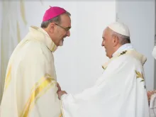 Pope Francis greets Latin Patriarch Pierbattista Pizzaballa of Jerusalem at a Mass at the GSP Stadium in Nicosia, Cyprus, Dec. 3, 2021.