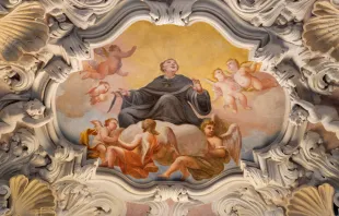 The baroque fresco of St. Nicholas of Tolentino by Morazzone, 16th century, in the side nave of Chiesa di San Agostino (Basilica of St. Augustine) in Rome. Renata Sedmakova/Shutterstock