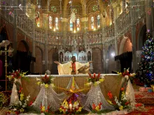 Christian devotees attend a prayer service at Sacred Heart Cathedral to celebrate Christmas in Lahore, Pakistan, on Dec. 25, 2021.