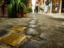 "Stumbling blocks" in Rome, Italy. Plates inscribed with the name and dates of life of the victim of Nazi persecution.