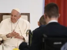 Pope Francis smiles during a meeting on April 29, 2023, with children and adults who are visually impaired and have other disabilities at a Catholic institute in Budapest, Hungary, dedicated to Blessed László Batthyány-Strattmann.