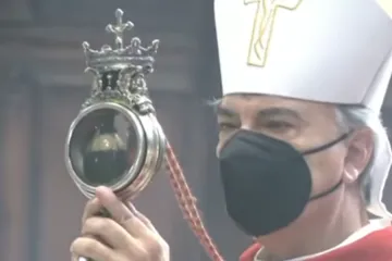 Archbishop Domenico Battaglia holds a reliquary containing St. Januarius’ liquefied blood in Naples Cathedral, Italy, Sept. 18, 2021.
