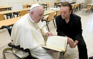 Pope Francis meets Bono at the launch of the Scholas Occurrentes International Educational Movement at the Pontifical Urban University in Rome, May 19, 2022. Vatican Media.