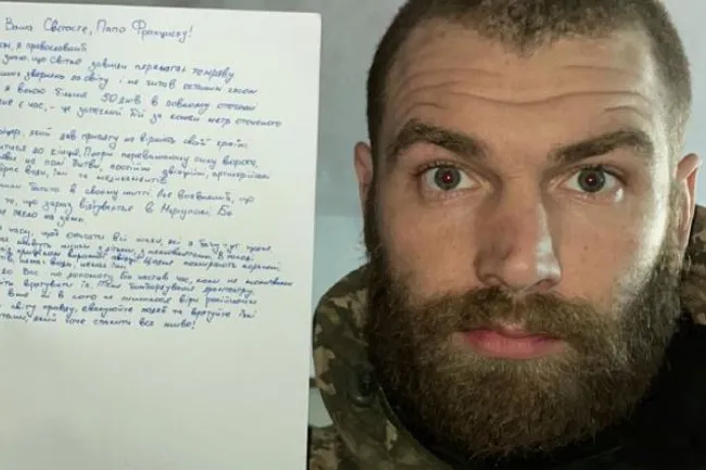 Major Serhiy Volyna, who has been leading the 36th marine brigade in the battle for the Ukrainian port city of Mariupol, pictured holding his letter to Pope Francis.?w=200&h=150