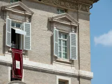 Pope Francis gives the Angelus message from a window overlooking St. Peter's Square