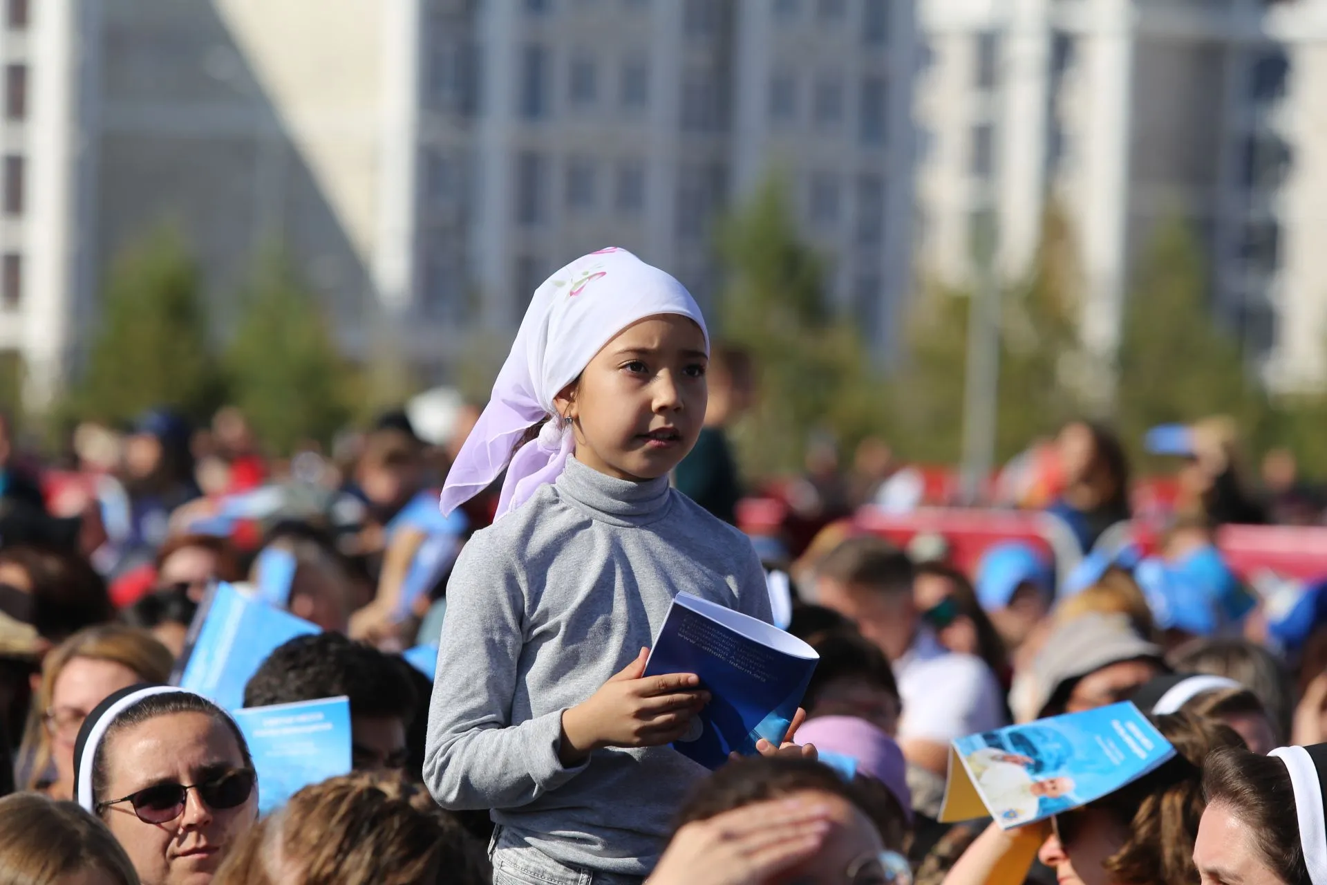 A young girl at a large outdoor Mass celebrated by Pope Francis in Kazakhstan’s capital of Nur-Sultan on Sept. 14, 2022.?w=200&h=150