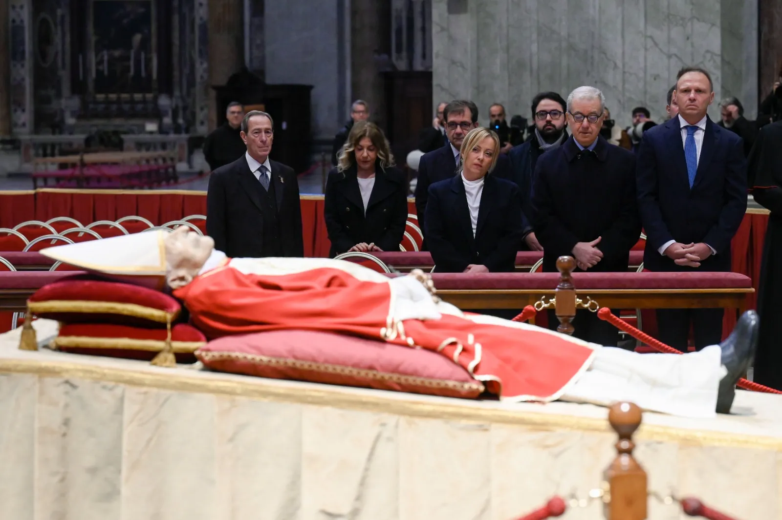 Italy's Prime Minister, Giorgia Meloni (third from left, front row) pays her respects to the late Pope Emeritus Benedict XVI at St. Peter's Basilica on Jan. 2, 2023. Vatican Media