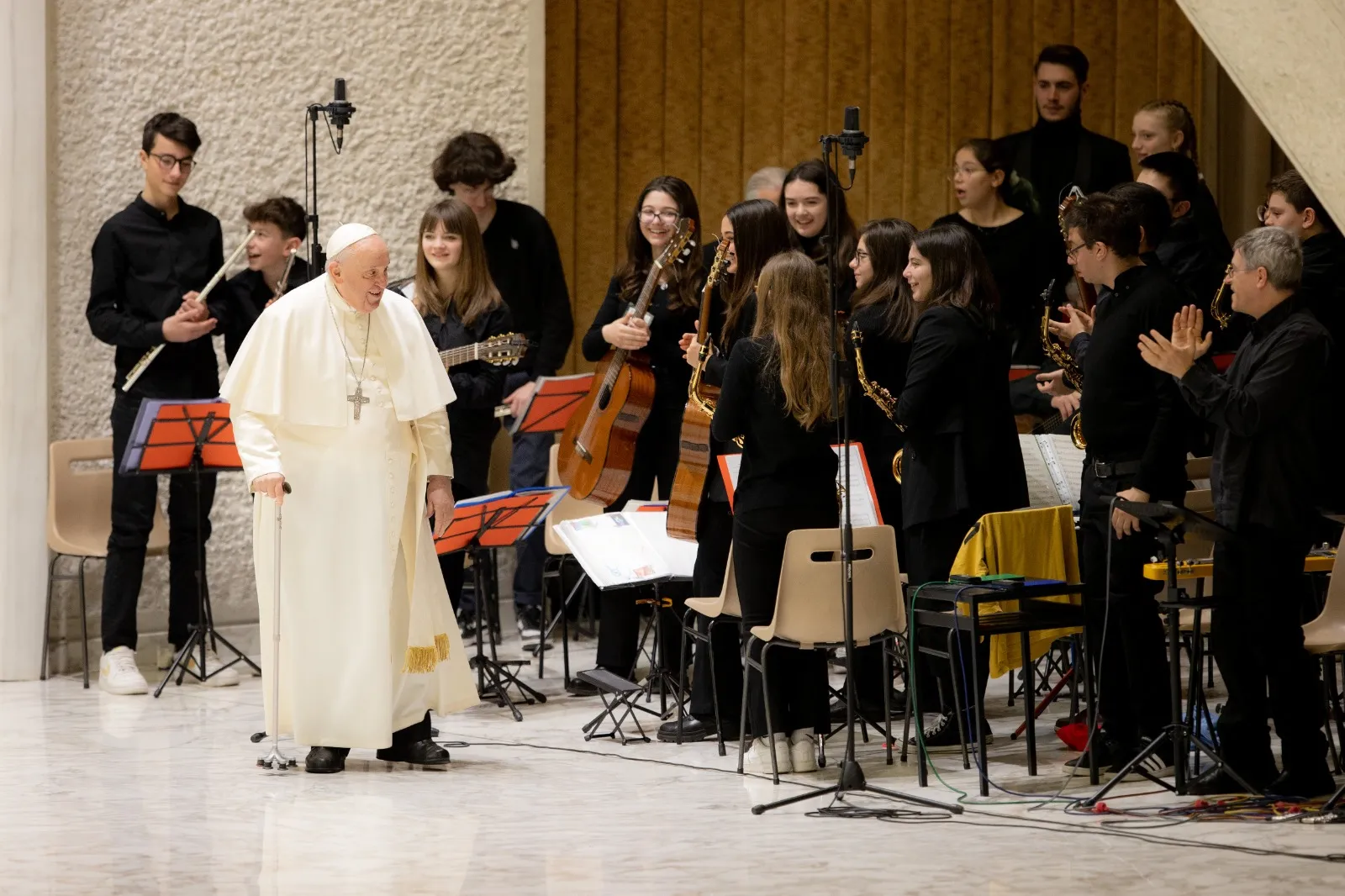 Pope Francis greets a youth orchestra who performed at the general audience on Feb. 15, 2023. Daniel Ibanez/CNA