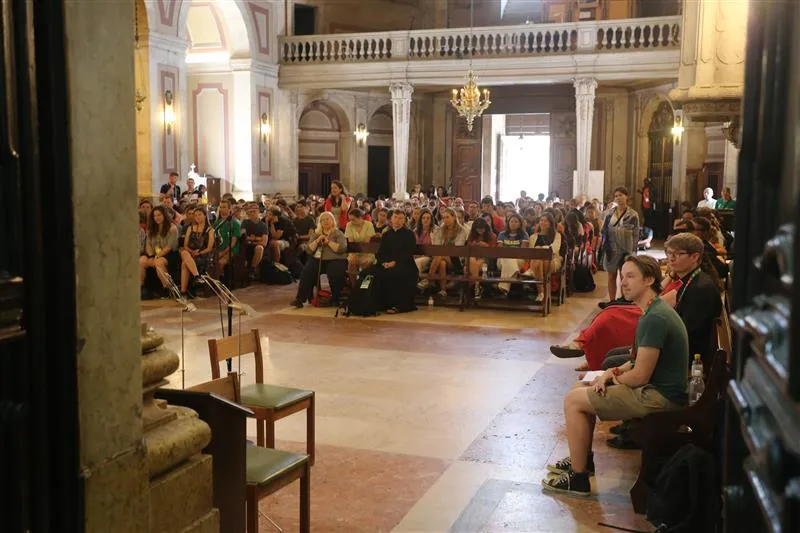 Gabriel Leblond, 25, from New York City, a member of the Emmanuel Community (far right), was the emcee for a Rise Up Encounter with Archbishop Charles Thompson in the Church of Our Lady of Providence in Lisbon, Portugal, on Aug. 2, 2023. Credit: Hannah Brockhaus/CNA