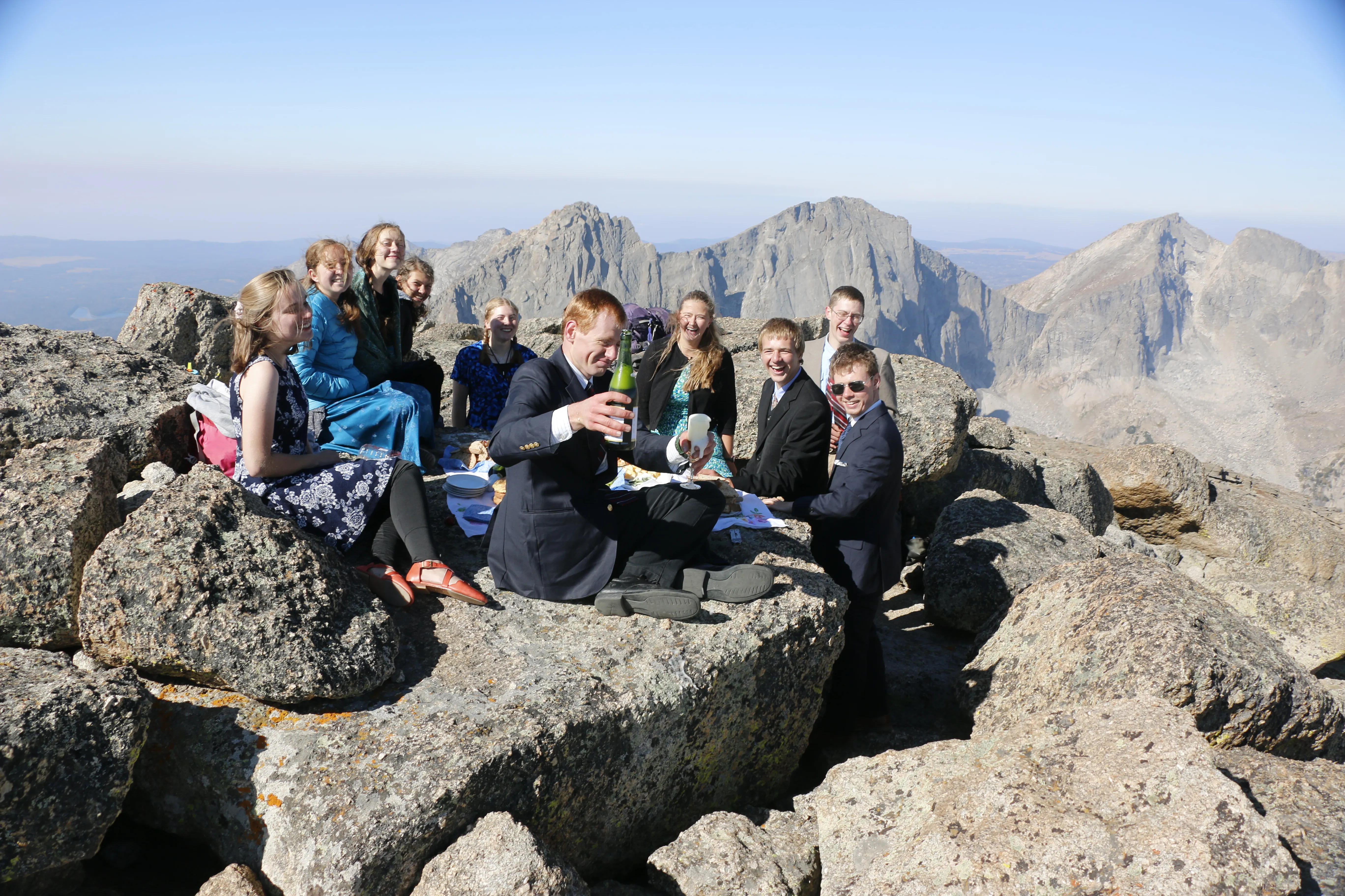 Wyoming Catholic College senior Margaret Serchen and fellow students climbed a mountain in the summer of 2022 and brought along dress clothes to enjoy a picnic on its summit. While there, Serchen even played a tune by Johann Sebastian Bach on her violin. Credit: Photo courtesy of Margaret Serchen