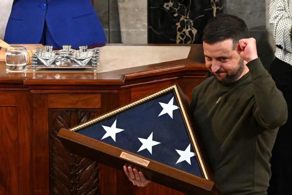 Ukraine's President Volodymyr Zelensky receives from U.S. House Speaker Nancy Pelosi (D-CA) (L) a US national flag during his address to the U.S. Congress at the U.S. Capitol in Washington, D.C. on Dec. 21, 2022.?w=200&h=150